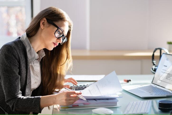 An accounting and payroll administrator student training in bookkeeping skills