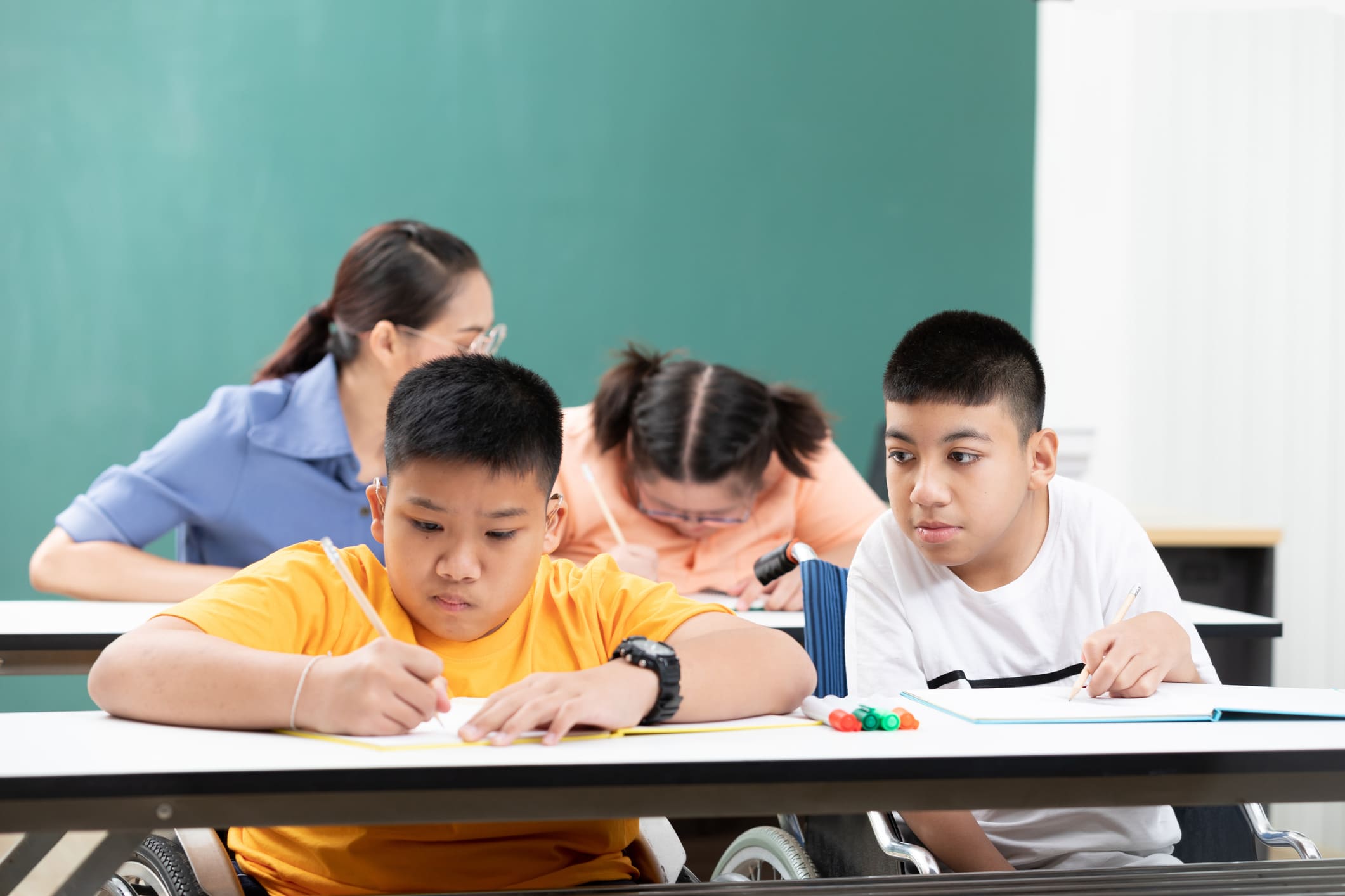 Educational assistant in action supporting students with diverse needs in BC schools.