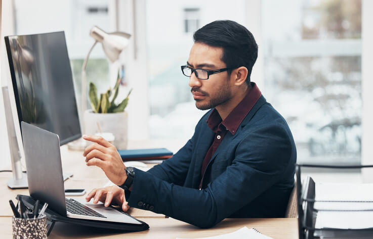 An accounting professional managing payroll software at work