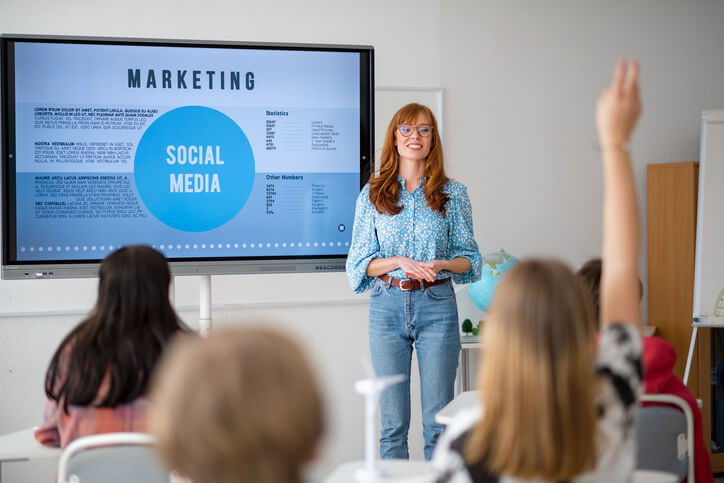 a group of students learning digital marketing tools in AOLCC&rsquo;s marketing coordinator program